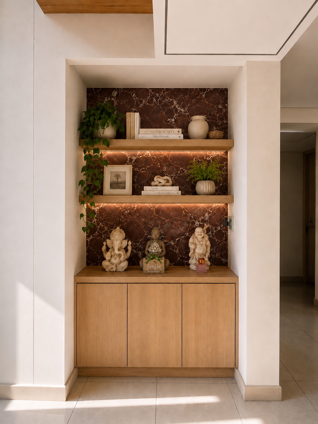 Recessed display niche with backlit dark veined stone, floating oak shelves and sculptural objects